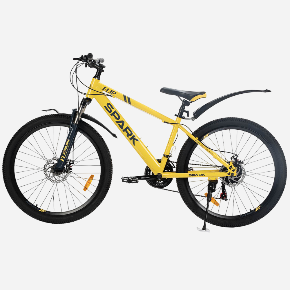Гірський велосипед Spark FLIP 26" сталева рама 15" жовтий, вид збоку зліва — амортизаційна вилка, дискові гальма, пластикові крила, підніжка, перемикач Shimano