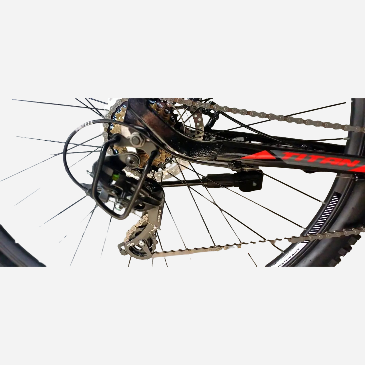Задній перемикач Shimano на велосипеді Titan Giant 30.5" — касета, ланцюг, дисковий ротор, спиці алюмінієвого обода